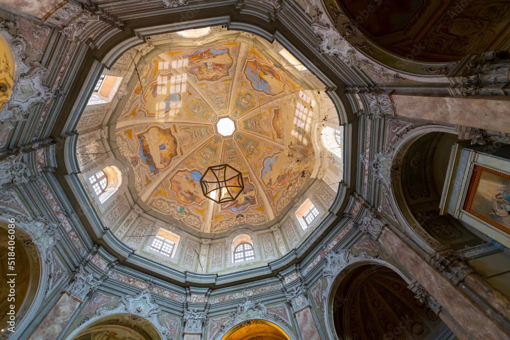Close up of the interior of the octagonal dome and ceiling of the historic Baroque Church of St. Catherine in Livorno, Italy.