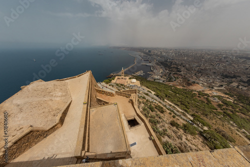 Panoramic view from the Santa Cruz fortress, one of the three forts in Oran, the second largest port city of Algeria; Summer hazy day, looking from high above towards the city. photo