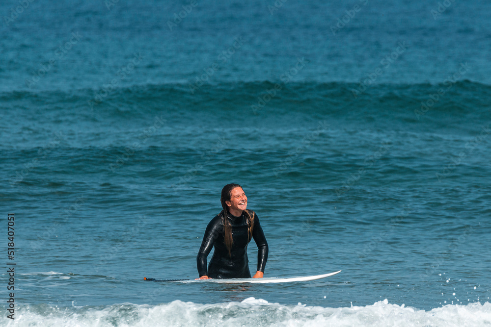 Positive woman with surfboard surfing waves Positive woman with surfboard surfing waves