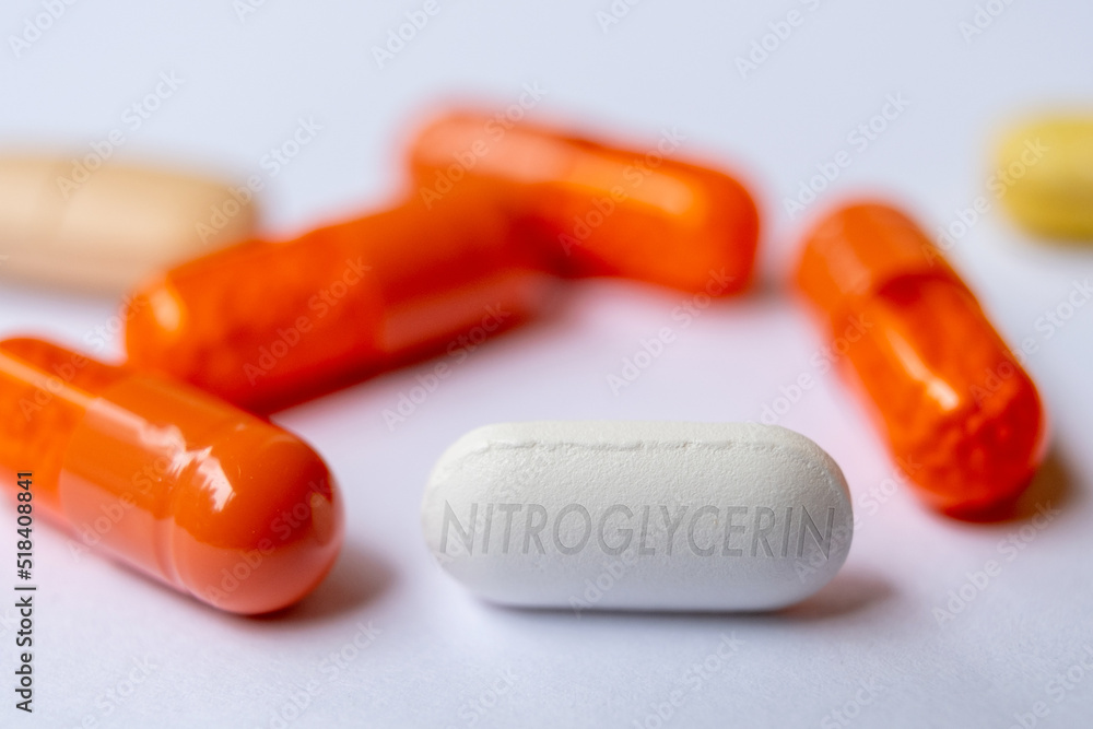Nitroglycerin tablet pill. Potent vasodilator medication used to treat