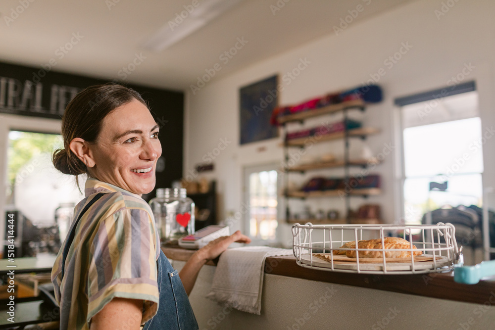 Joyful woman working at cute coffee shop portrait Joyful woman working at cute coffee shop portrait