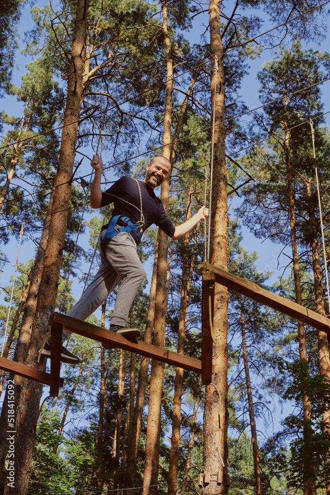 Man steps on the rope hanging in the air Man steps on the rope hanging in the air