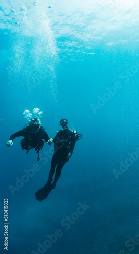 Wallpaper Mural couple diving in the clear water at the Tubbataha Reef Torontodigital.ca
