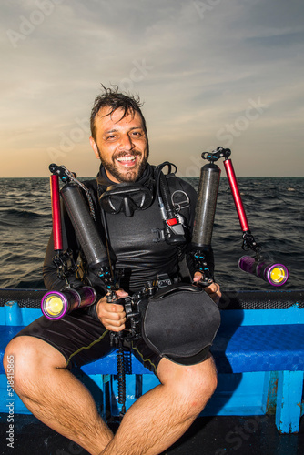 man with underwater camera at Tubbataha reef photo