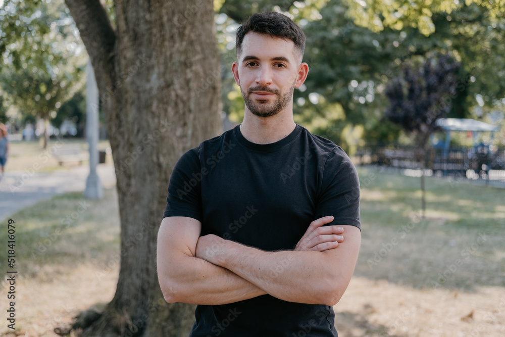 Young adult male relaxing in park during summer Young adult male relaxing in park during summer