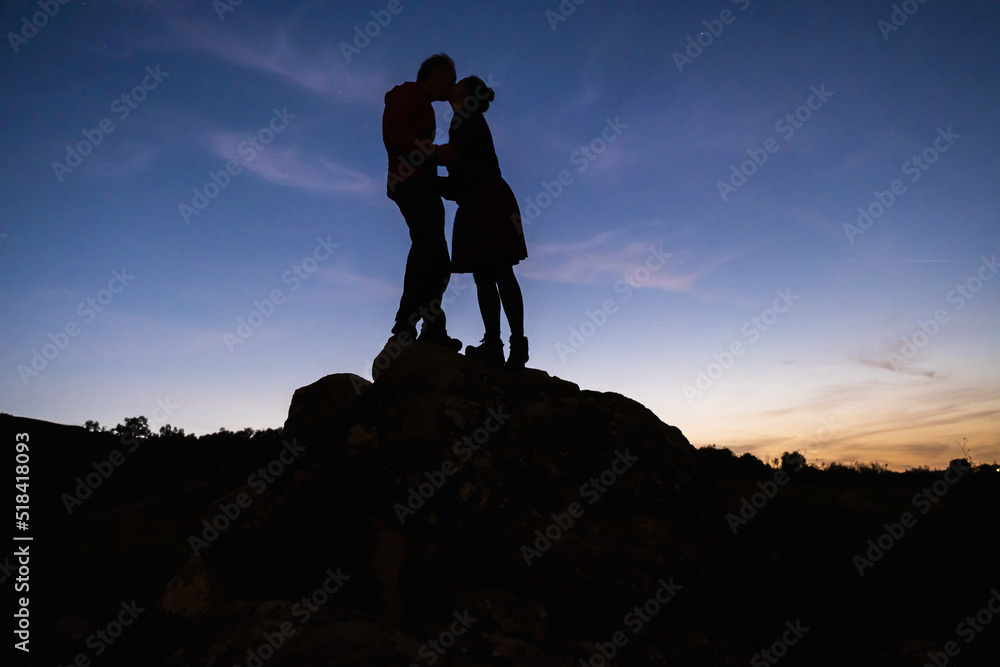silhouette kissing at sunset Stock Photo | Adobe Stock