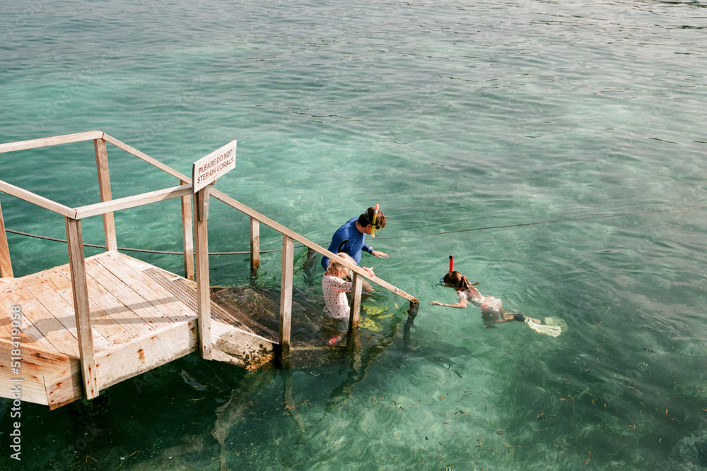Family snorkelling time in the sea Family snorkelling time in the sea