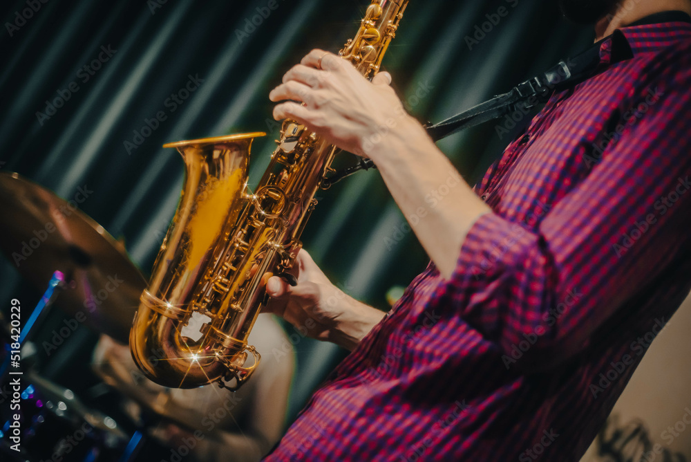 Obraz premium playing the saxophone. performer plays at a concert