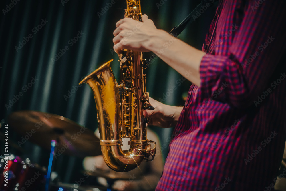 Obraz premium playing the saxophone. performer plays at a concert