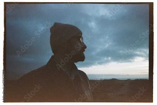 Man looking away, shot on film photo