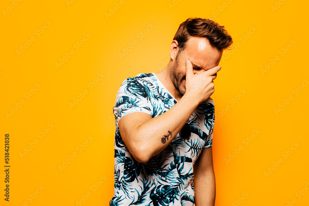 Smiling stylish man in t shirt with tropical print Smiling stylish man in t shirt with tropical print