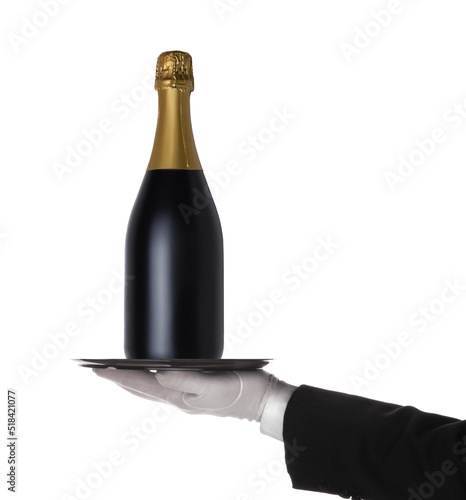 Waiter holding a silver tray with a bottle of Champagne isolated on white, hand and arm only. © Steve Cukrov