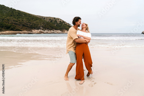 Happy couple at the beach photo