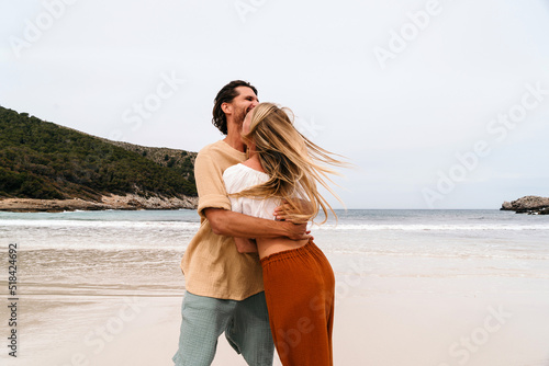 Happy couple at the beach photo