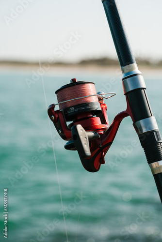 Modern fishing rod with line around reel