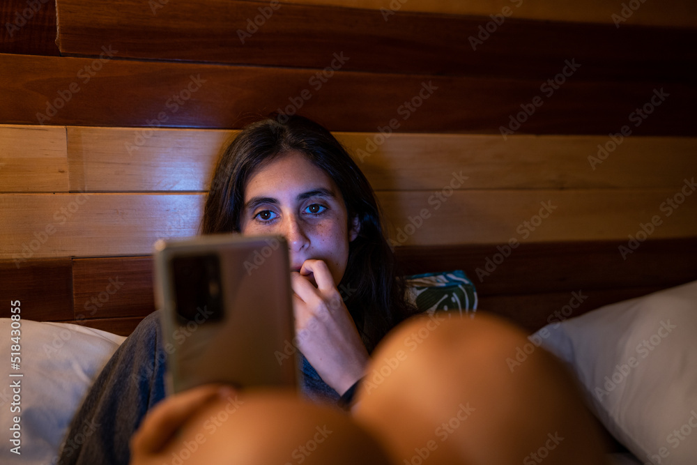 woman holding her phone woman holding her phone