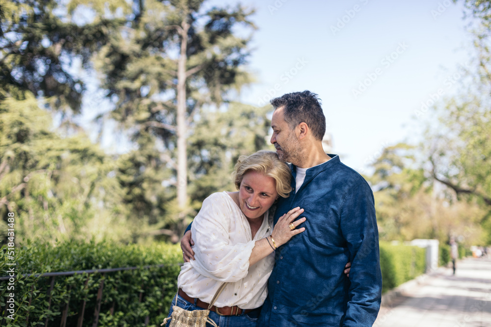 Middle-aged couple walking in the city Middle-aged couple walking in the city