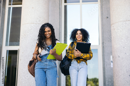 Young students leaving university photo