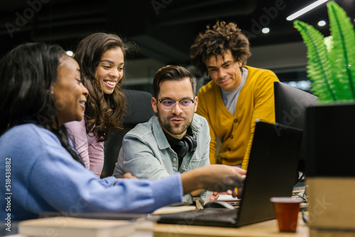 Group Of Colleagues Discussing Their Work In The Office photo