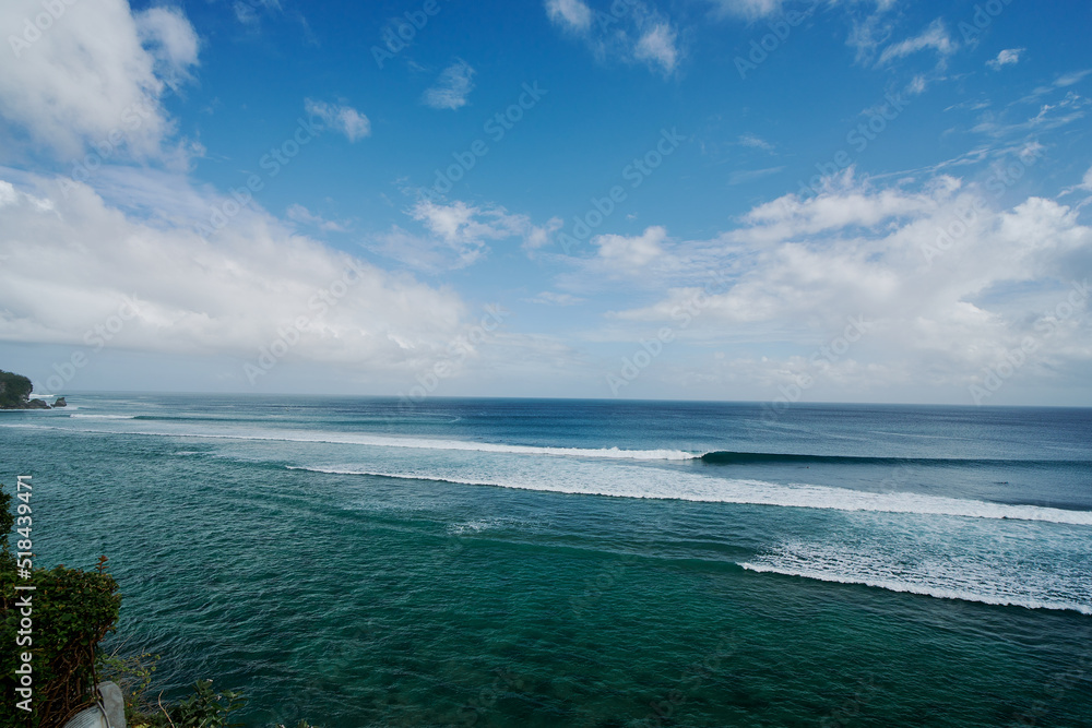 wide angle view of sea and waves at padang padang beach in bali indonesia wide angle view of sea and waves at padang padang beach in bali indonesia