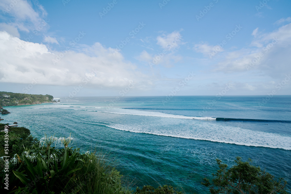 wide angle view of sea and waves at padang padang beach in bali indonesia