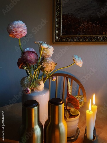 Flowers on the table with candles photo