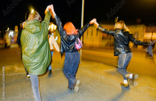 Having Fun Female Friends Walking City Street photo