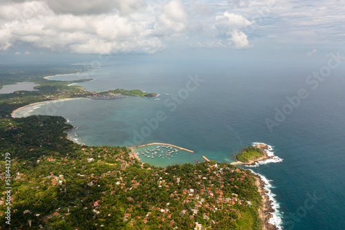 Aerial view of bay and the coast with hotels in Sri Lanka.