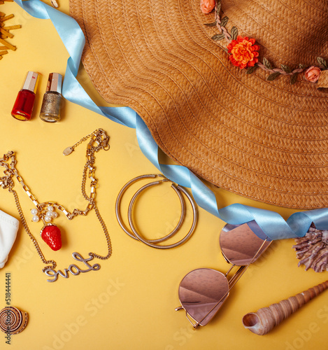 diverse travel girlish stuff on colorful background blue and yellow, nobody tourism lifestyle concept close up