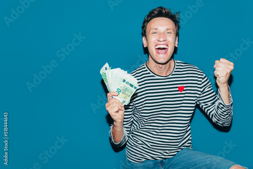 Happy Man Holding Money  photo