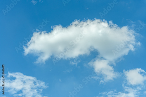 White clouds float in the sky in summer. Sunny day, sea of clouds, sky and weather material.