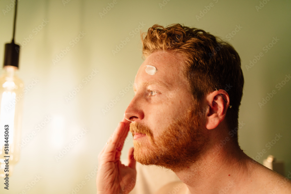 Man applying cream Man applying cream