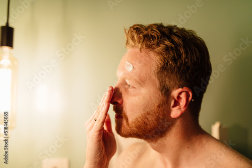 Man applying cream photo