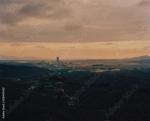 Industrial Plant In Vast Mountain Landscape photo