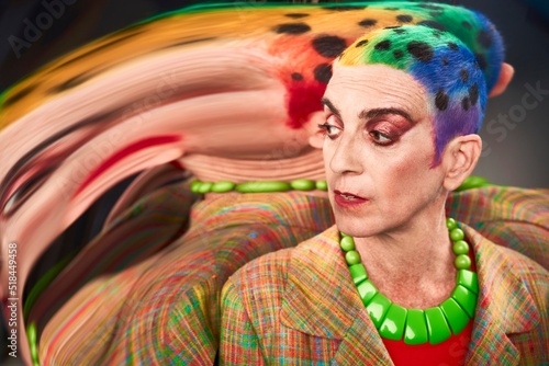Determined mature alternative woman with rainbow hair