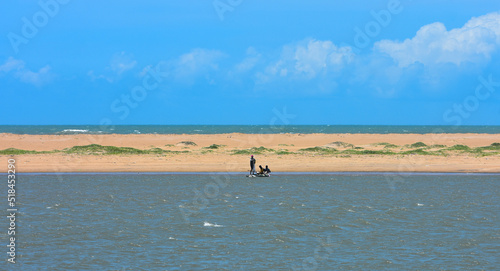 Tropical sand beach and the Calm Bay of Bengal sea on Puri, Odisha.