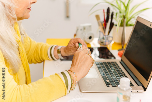 Anonymous businesswoman at her desk