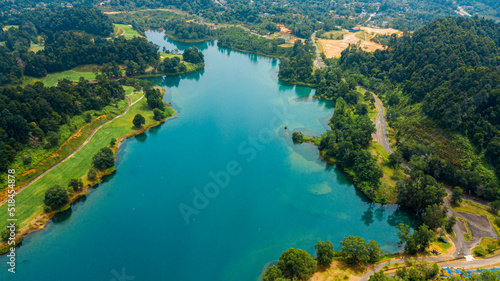 Aerial drone view of lake scenery with turquoise water in Tasik Puteri, Bukit Besi, Terengganu, Malaysia.