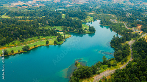 Aerial drone view of lake scenery with turquoise water in Tasik Puteri, Bukit Besi, Terengganu, Malaysia. © MUAZ JAFFAR