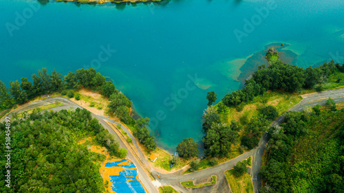 Fototapeta Naklejka Na Ścianę i Meble -  Aerial drone view of lake scenery with turquoise water in Tasik Puteri, Bukit Besi, Terengganu, Malaysia.