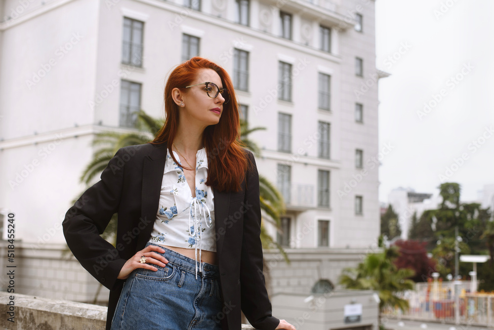 Confident woman standing outdoors Confident woman standing outdoors