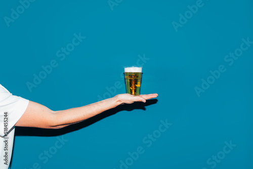 Man Holding Glass of Beer photo