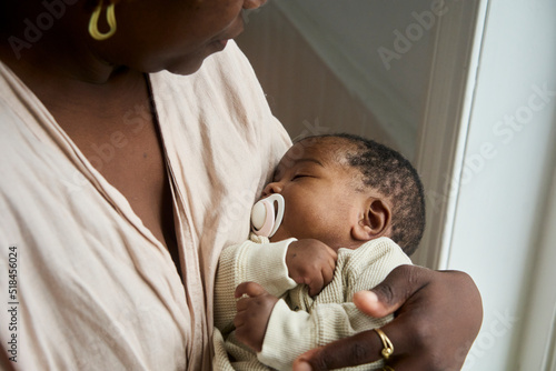 Sleeping baby with pacifier photo