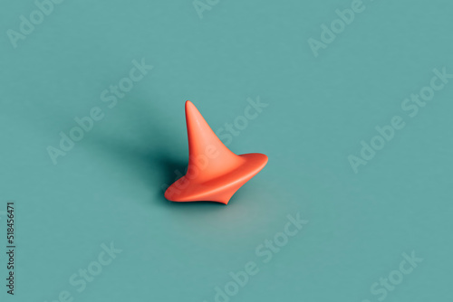 a pink spinning top on a blue background photo