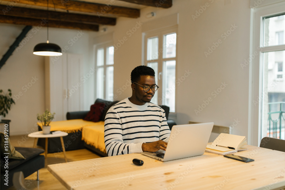 Man working online via computer from home Man working online via computer from home