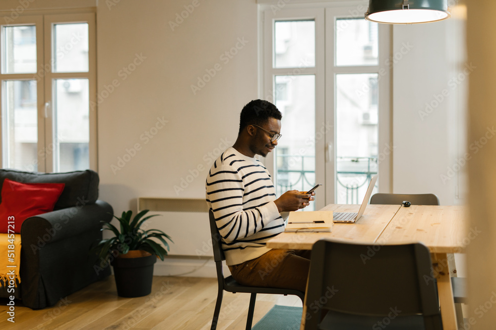Man using smartphone at home Man using smartphone at home