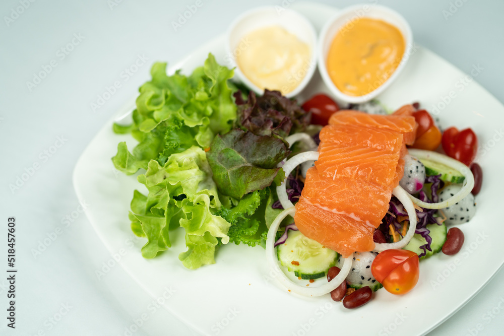 salmon salad white background 
with vegetables