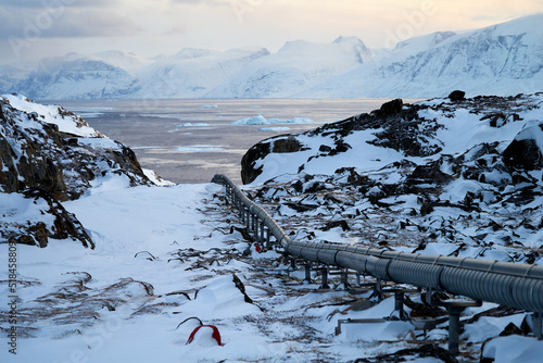 Greenland Arctic pipeline in frozen landscape photo