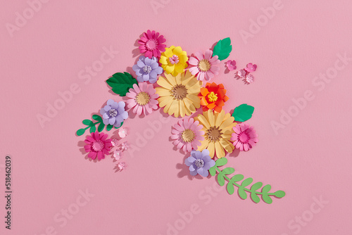 Flat lay of floral background with handmade paper flowers photo