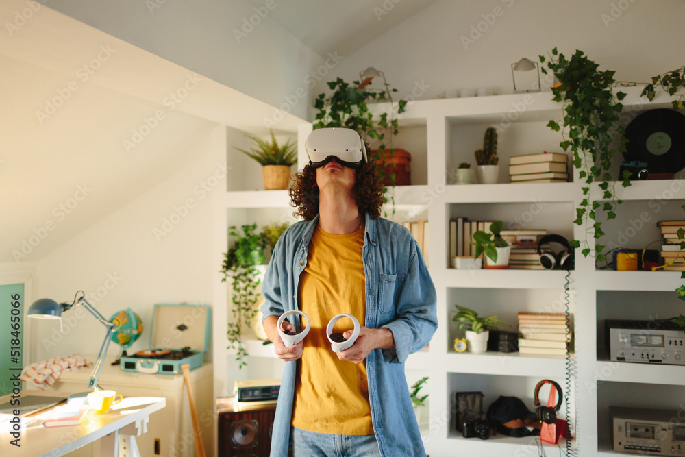 Young man using VR for playing games Young man using VR for playing games